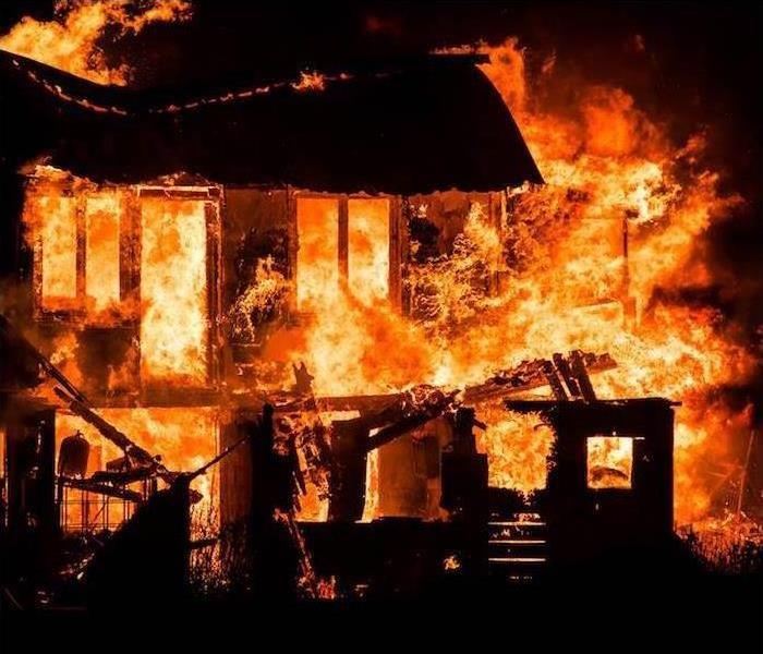 ?House consumed in flames